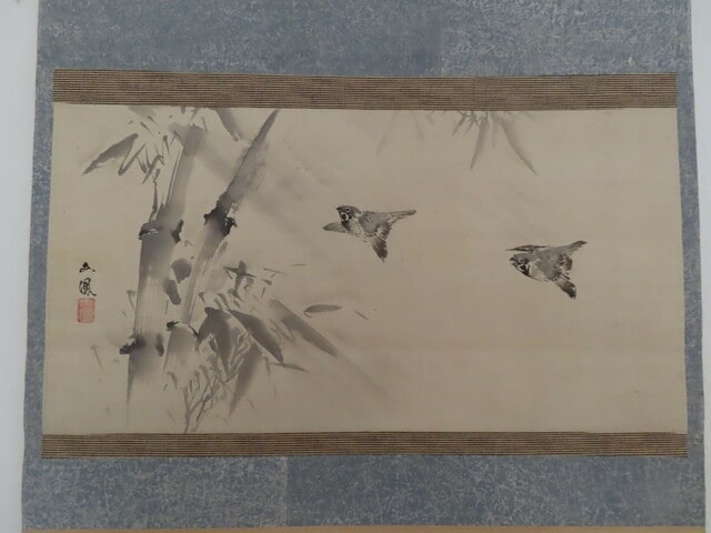 Two sparrows flying in rain with bamboo
