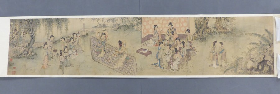 Women in a garden playing music and dancing